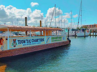Tiki Boat Barge in the Water 