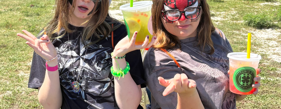 girls posing with face paint on