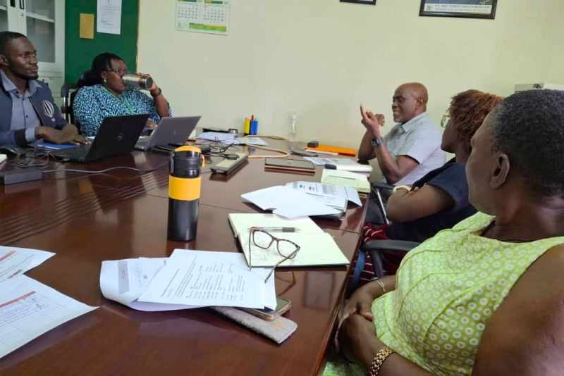 Kenly (far right) meets stakeholders.