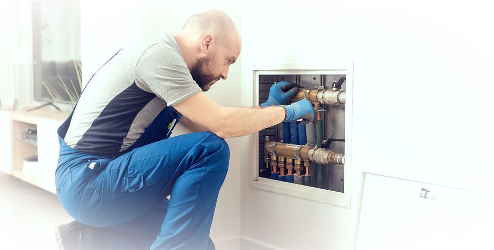 Professional plumber installing plumbing manifolds at home, home improvement and repair co