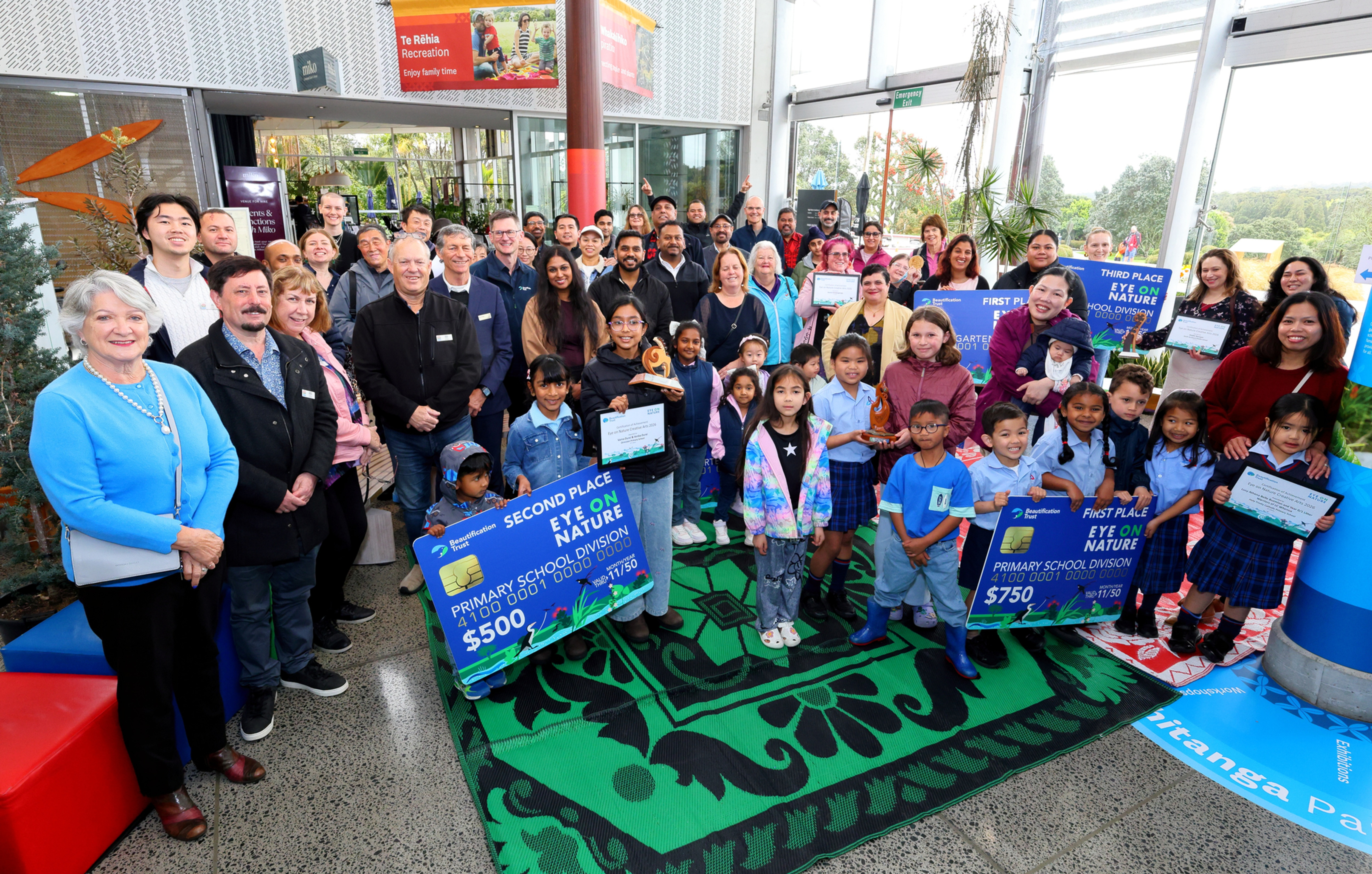 Group photo during the prizegiving ceremony for Eye on Nature Creative Arts, at the Auckland Botanic Gardens.