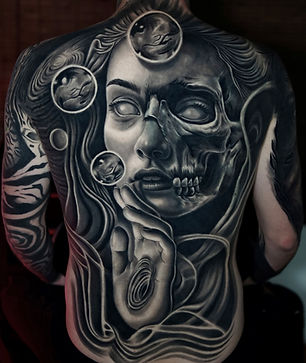 Full back tattoo in black and gray