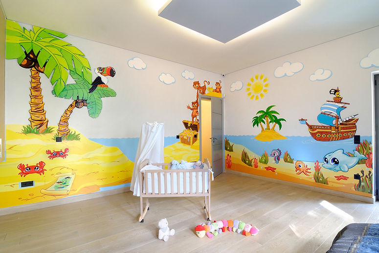 Photos of the animino Caribbean Room, a fun and colorful combination of mixed media. Mural artwork, drawings, Smart Forex colored and painted cutouts.