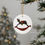Thumbnail: Black rocking horse Christmas ornament with red saddle.