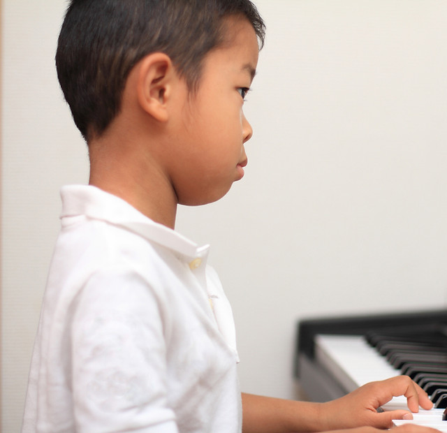 Boy Playing Synthesizer