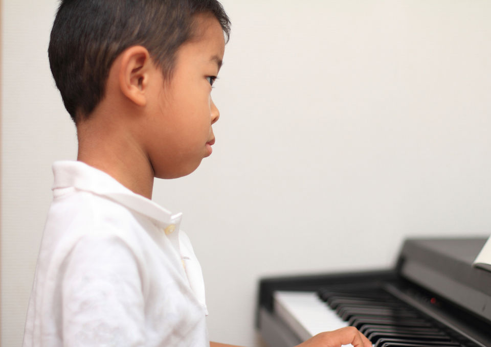 Boy Playing Synthesizer