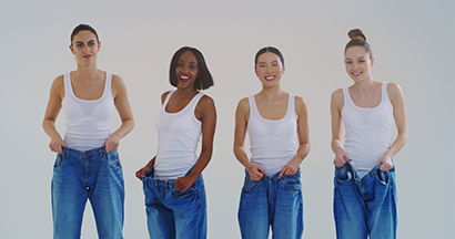 Four happy women show weight loss from holistic wellness center services