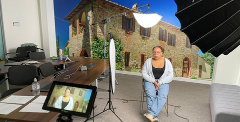 Woman in studio recording YouTube Short for Viator