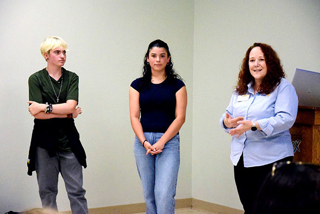 Asher Soucie of Amherstburg (left) and Liv Scratch of Leamington (centre) listen as Suzanne Grouette from the Rotary Club of WIndsor-Wide speaks. Soucie and Scratch both discussed their experiences at a Youth to Youth conference they went to in Nova Scotia. The presentation was at the McGregor Community Centre.