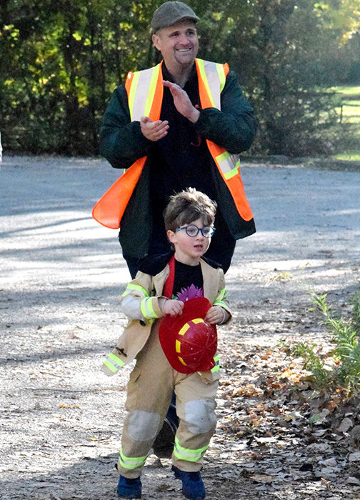 Sully Lowe runs with his father, Brian.