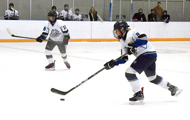 North Star’s Aria Pare carries the puck over the Essex blue line Feb. 4 at the Libro Centre. Essex won the game 3-0 but North Star rebounded the next day on the road with a 3-2 win over Cardinal Carter.