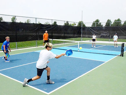 Young pickleball players learn the basics at a summer camp