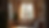 Eye-level view of a cozy living room with a “For Sale” sign outside the window