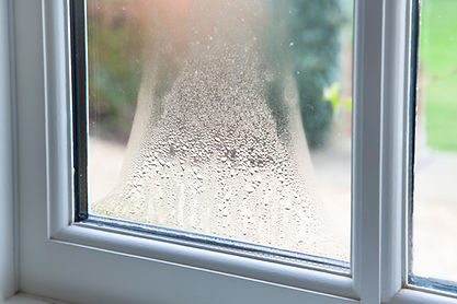 Close up of blown double glazed unit. Failed window glazing with condensation inside, UK.j