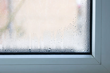 Close up of double glazed window condensation causes by excessive moisture in the house i