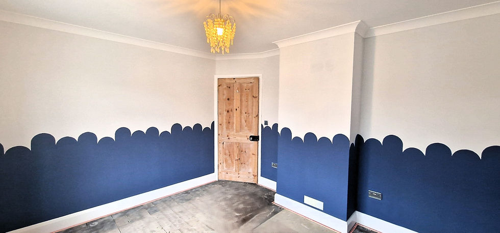 Completed bedroom decoration in Abridge, Essex by LCR Projects. Featuring grey and blue bespoke hand painted room border.