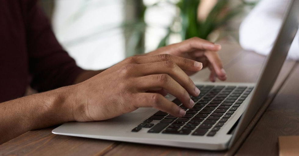 hands typing on keyboard