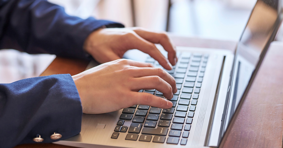 hands typing on a keyboard