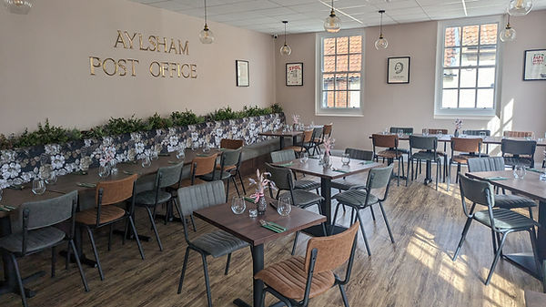 aylsham post office, stamp pizza seating area, stamp restaurant, harry malt artwork