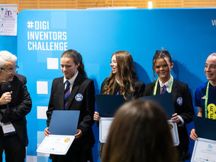 Professor George Crooks OBE, CEO at Digital Health & Care Innovation Centre, presenting the award to the winning team