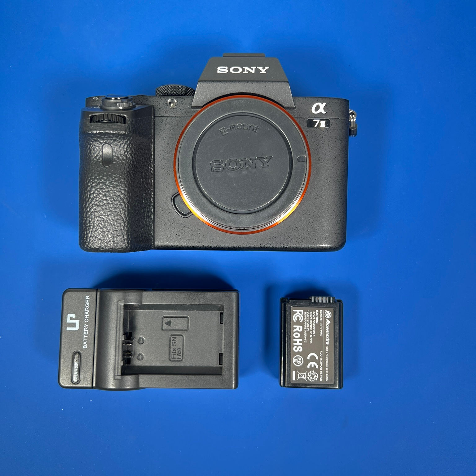 Sony Alpha a7 II full-frame mirrorless camera with body cap, battery and charger