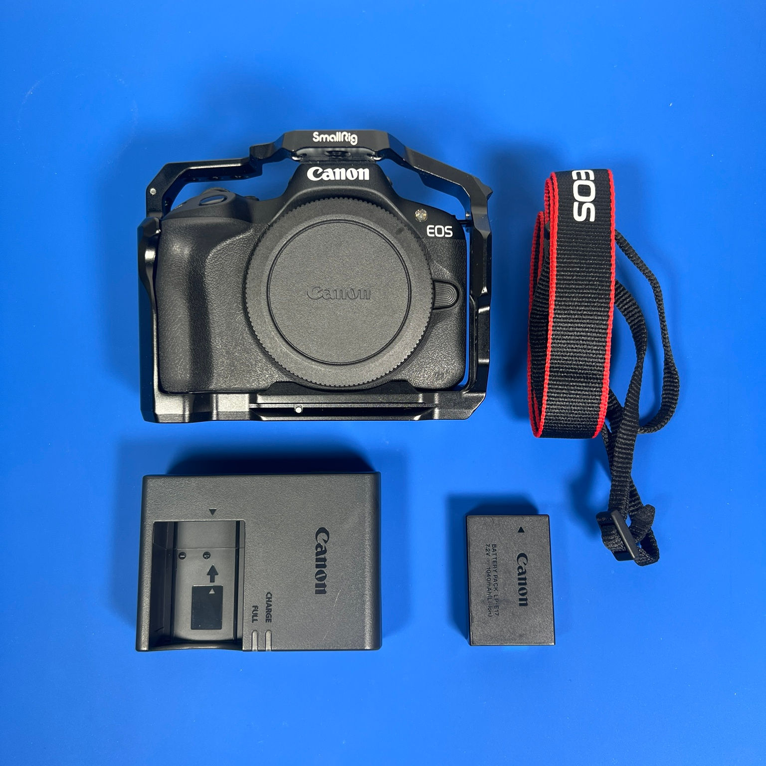 Canon EOS R50 camera body with SmallRig cage, battery, charger, strap and body cap