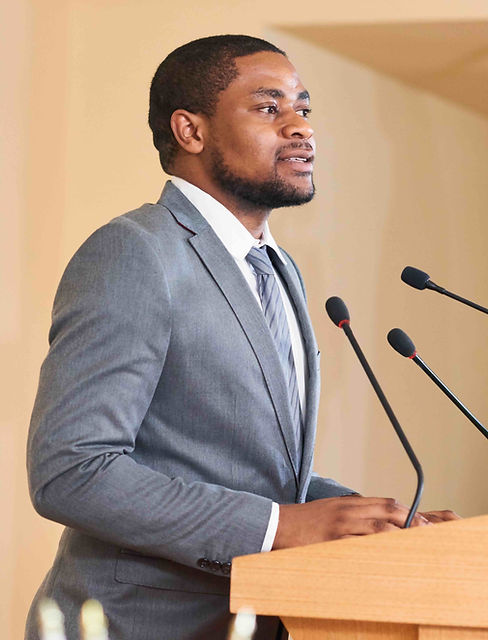 young-african-american-male-speaker-talking-in-mic-2023-11-27-05-24-36-utc (1).jpeg