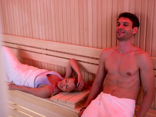 Male and female in infrared sauna