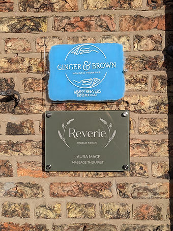 brick wall signs ginger brown reverie massage therapy small business