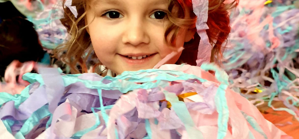Child covered in paper streamers paper disco party
As the party winds down, we capture these precious moments of joy and laughter. From the wide smiles to the gleeful giggles, every expression tells a story of unforgettable fun. These memories will be treasured for years to come, reminding you of the magic of our paper disco party.
