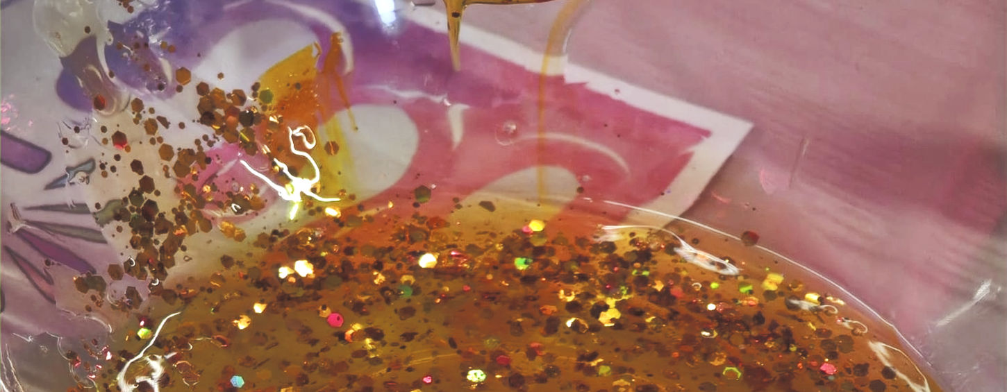 glitter slime being mixed in a bowl