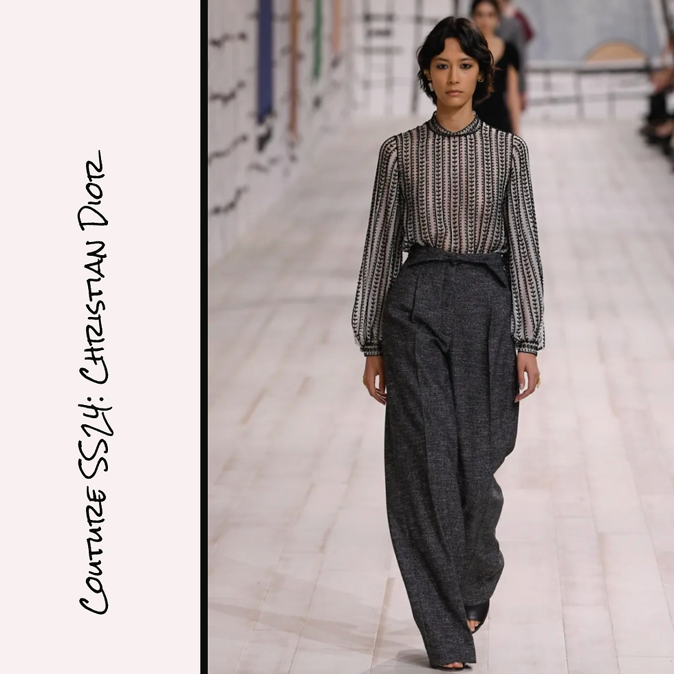 Haute Couture Spring Summer 2024/Haute Couture SS24: Christian Dior Long Sleeve, High Neck Blouse in Off White with Black Embroidery in Feminine Graphic Pattern, Tucked into Charcoal Grey Gray Wide Leg Trousers with Fold-Over Waistband