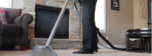 Man cleaning carpet