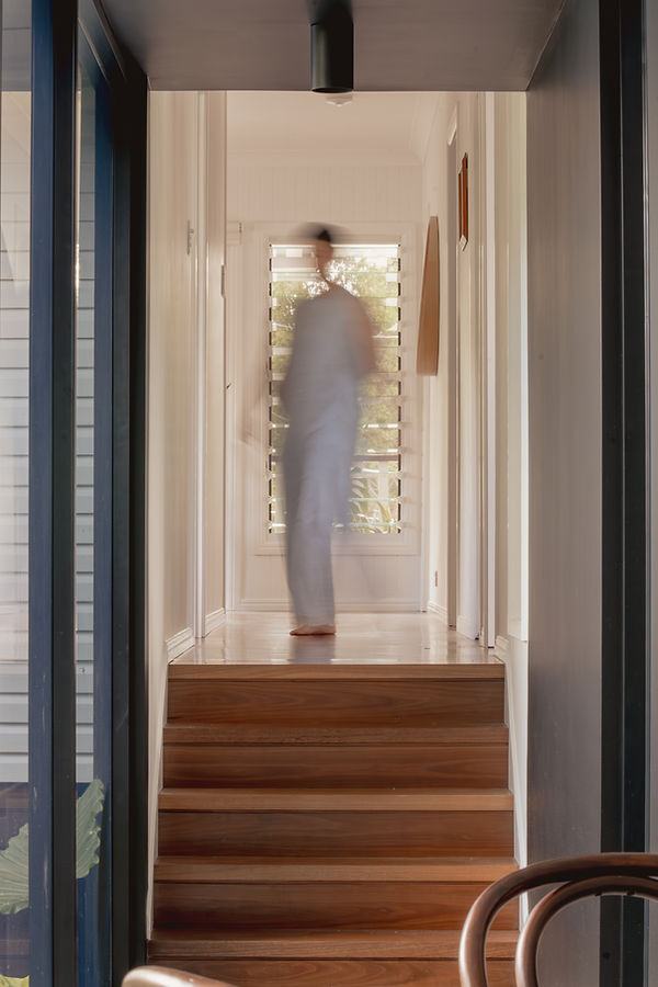 Shanty walking blurred in a hallway designed by haus of gray