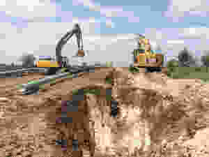 Pipe being gently lain into the ditch Credit: Mothership Aeronautics