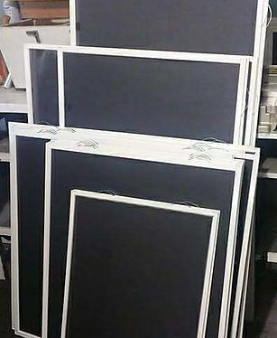 stacked screens against wall.jpg