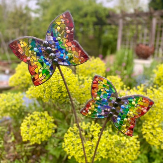 rainbow butterfly garden sculptures made with glass mosaics