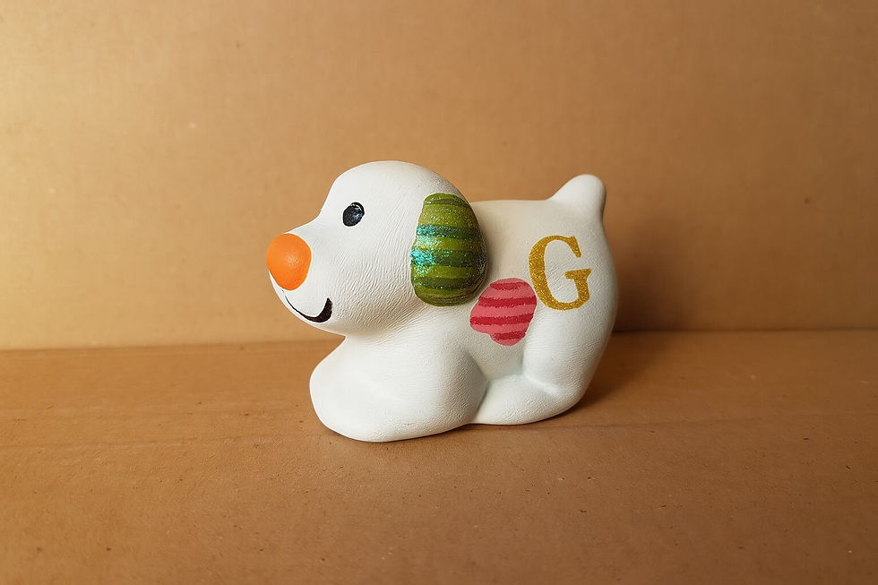 Thumbnail: Hand painted snowy dog ceramic figure with personalised initial