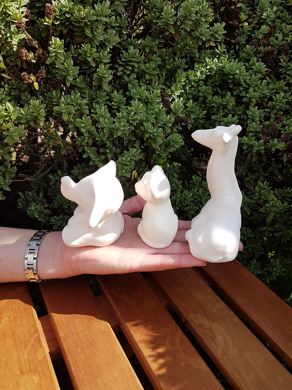 Thumbnail: African animal babies set of elephant giraffe & lion cub ceramic bisque figures in hand for scale