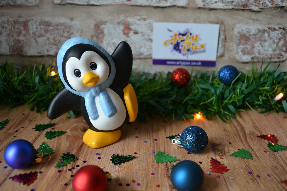 Thumbnail: Hand painted ceramic dancing penguin with blue headscarf figure front view