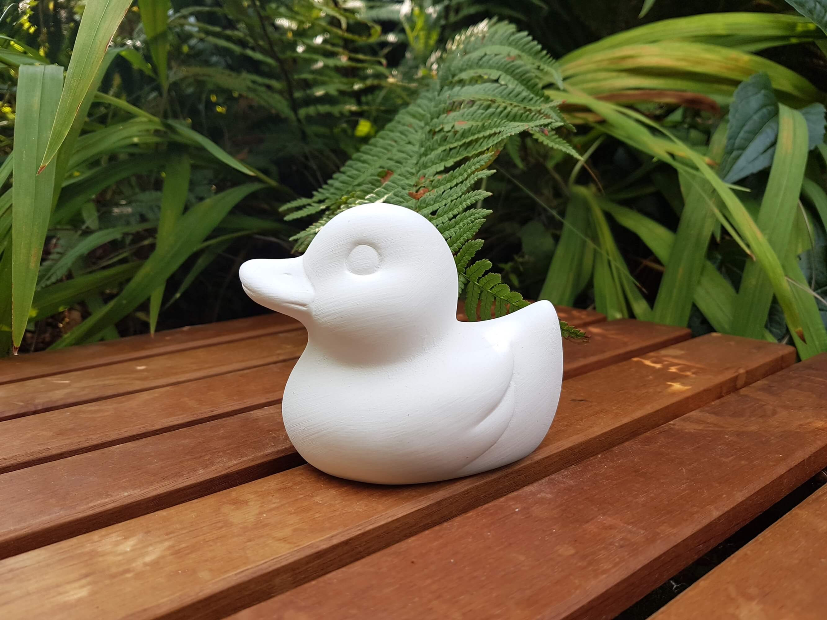 Rubber duck ceramic figure left side view