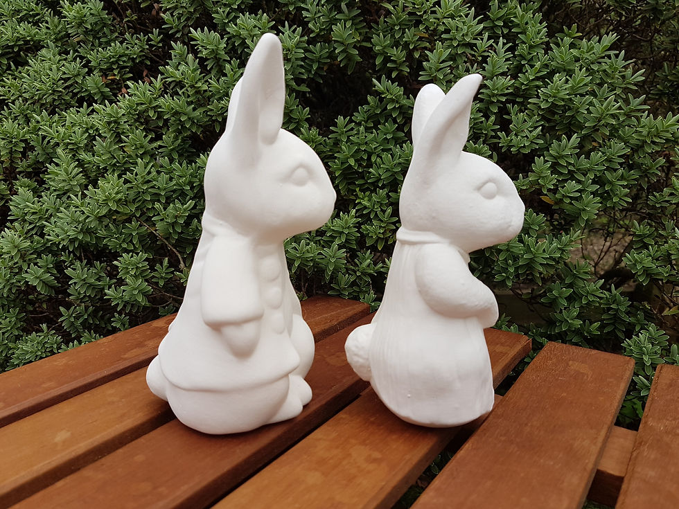 Thumbnail: Peter Rabbit and female rabbit ceramic figure pair right side view