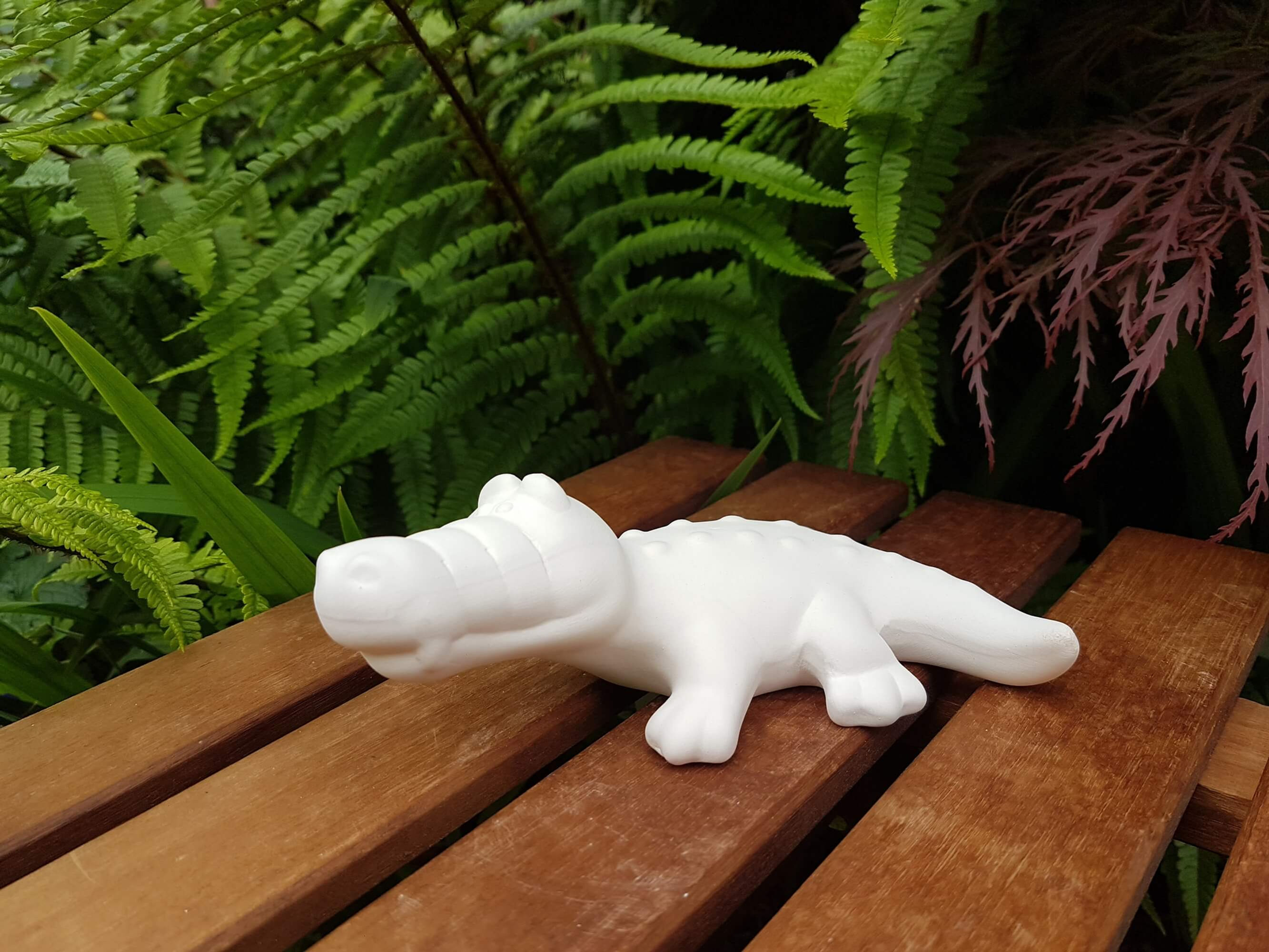 Ceramic bisque crocodile alligator figure left side view
