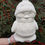 Thumbnail: Christmas Jumper penguin ceramic tea light holder in hand for scale