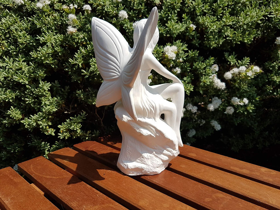 Thumbnail: Ceramic bisque fairy on rock figure back right view