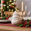 Thumbnail: Ceramic bobblehat snowman figure on Christmas table with tartan table runner