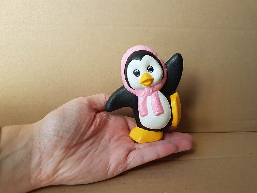 Thumbnail: Penguin with headscarf figure hand painted in hand for scale