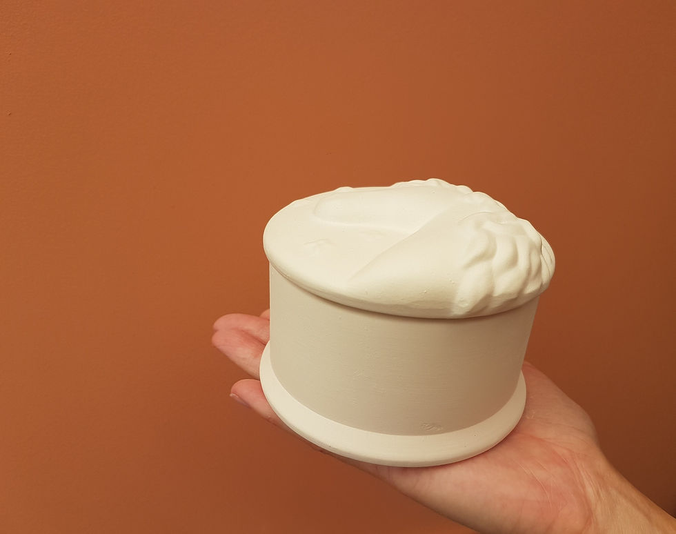 Thumbnail: Ceramic unicorn trinket box with removable lid in hand for scale