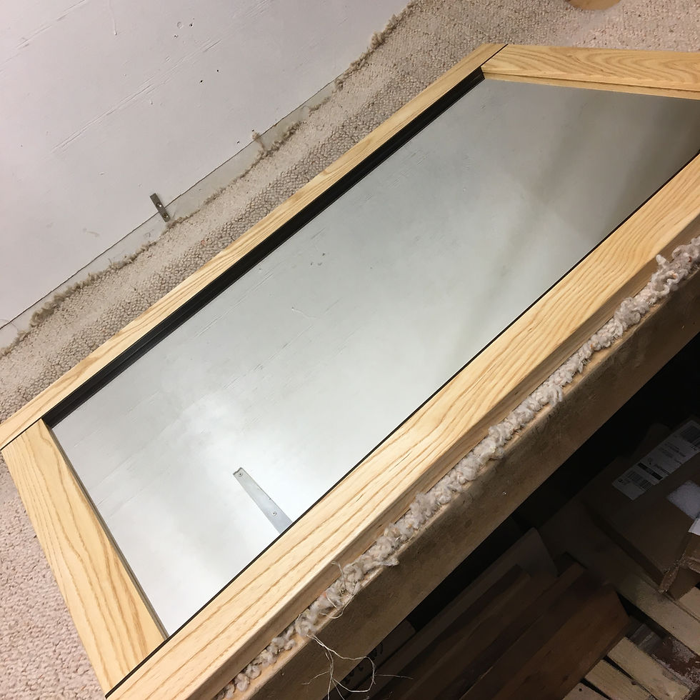 Bespoke wall mirror made from ash and fumed oak