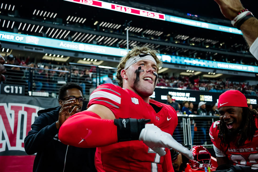 UNLV defensive back Jake Pope celebrates with his teammates after hauling in the team's lone interception in its win against Hawaii. Photo Credit: UNLV Athletics